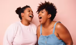 two young women posing for the camera
