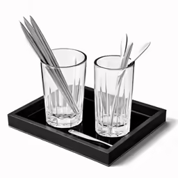 two drinking glasses and a straw set on a tray
