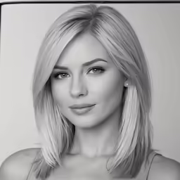 a woman wearing a tank top posing for a black and white photo