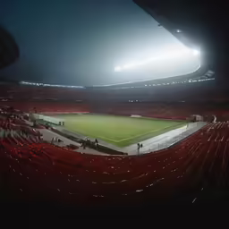 stadium with lights shining brightly on it at night
