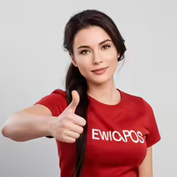a girl giving a thumbs up sign with her fingers