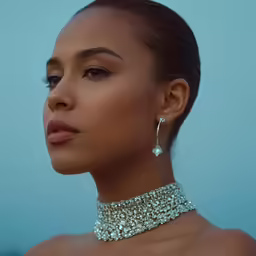 a woman in a diamond choker and earrings