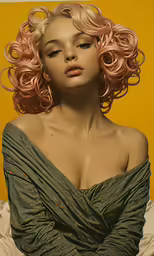 a young blonde woman with a very long curly hair