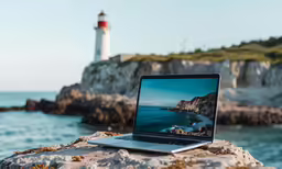 laptop computer with a picture of the lighthouse