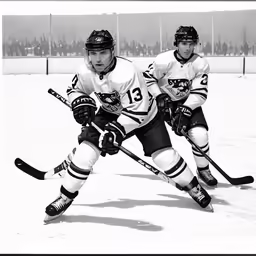 two boys playing hockey in a rink