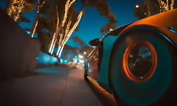 a orange and blue car with an orange rim