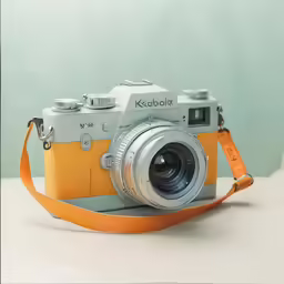 a camera with yellow strap sitting on top of a table