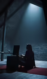 a person is working on a computer on a stage