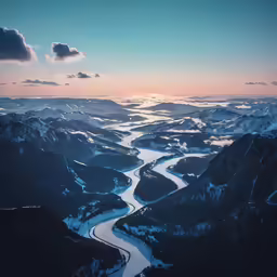 a snow covered landscape of mountains and a river