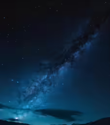 a long time exposure photograph of stars and a field