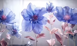 blue flowers are growing with their buds in the sun