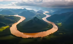 aerial shot of river, green mountains and sky