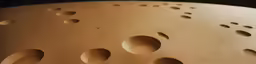 a drum with holes in the center and dots