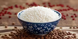 white rice and beans in a blue and white bowl on a table