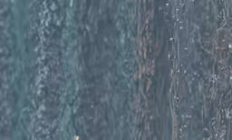 drops of water flying off a tall building