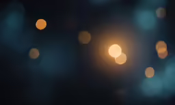 boket lights against a black backdrop and blurry blue lights