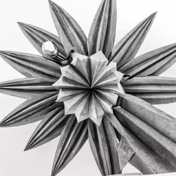 a black and white photo of a flower design with lots of small shapes