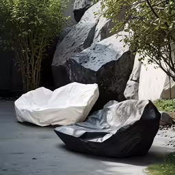 some big rocks that are sitting in the grass