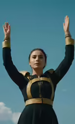 a woman with her arms in the air
