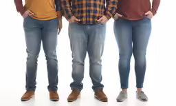 three people stand in line to pose for a picture