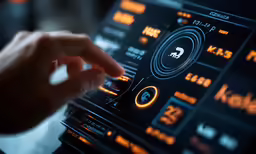 the fingers are touching the music on the laptop