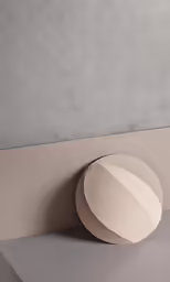 the grey and beige round object hanging from the ceiling