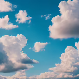 an airplane flying in the blue sky