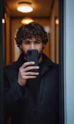 a man taking a photo with his cell phone