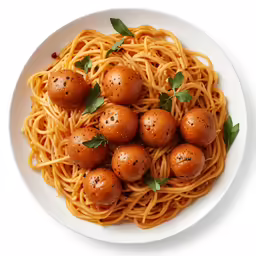 a white plate topped with pasta and meatballs