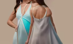 two beautiful young women are standing and facing away