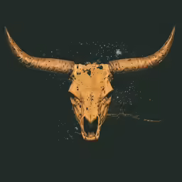 a bull skull with speckled paint on the face