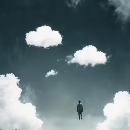 a person is standing in front of several fluffy clouds