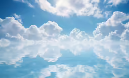 a photo taken from water looking up at some clouds in the sky