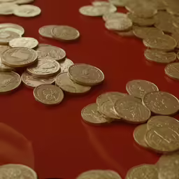 a large pile of penns on a red table