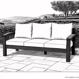 black and white photograph of a couch with three pillows
