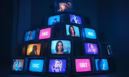 tv displays with different colors are displayed in a pyramid