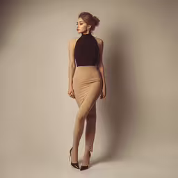 a woman wearing a tight bodysuit and heels,a young woman standing against a wall in a tight brown skirt