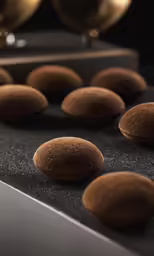 there is a table with many large brown items on it