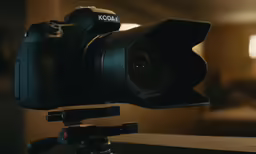 a camera is attached to the tripod