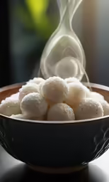 several balls of rice are in a blue bowl on a dark table