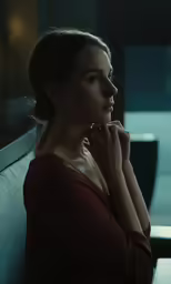 the woman is sitting down alone looking away