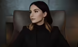 a close up view of a person sitting in a chair