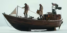 the two gentlemen are standing on the boat