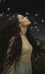 there is a woman wearing a light shirt near flowers