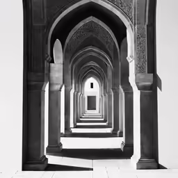 an arched hallway with black and white color