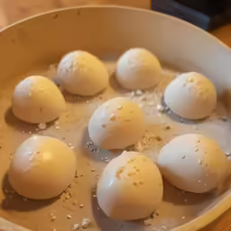 a pan full of eggs are sitting on the counter
