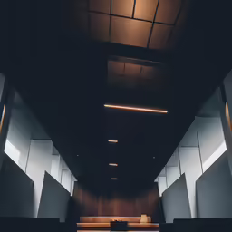 the inside of an office with white and brown walls