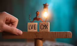 someone arranging blocks spelling live and oak together