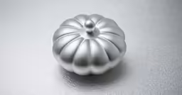 a white, circular - shaped metal object on a silver surface