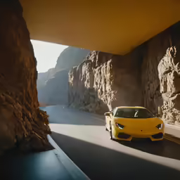 the sports car is going down the mountain road